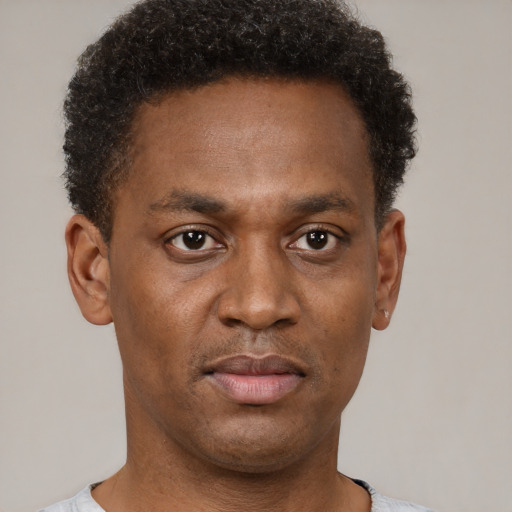Neutral black adult male with short  brown hair and brown eyes