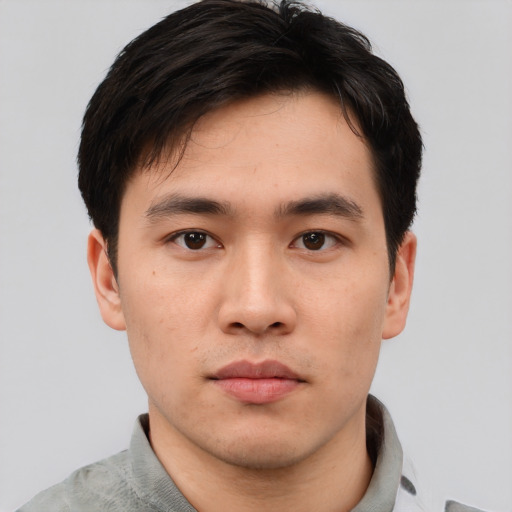 Neutral asian young-adult male with short  brown hair and brown eyes