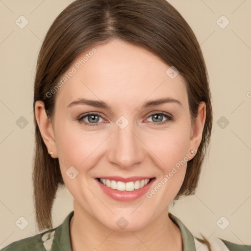 Joyful white young-adult female with medium  brown hair and grey eyes