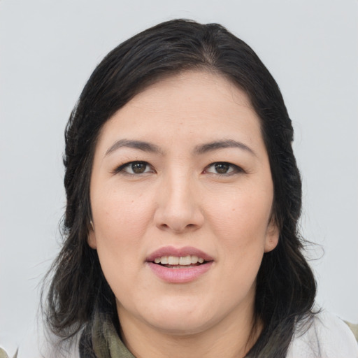 Joyful white young-adult female with medium  black hair and brown eyes