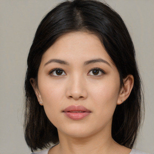 Neutral asian young-adult female with medium  black hair and brown eyes