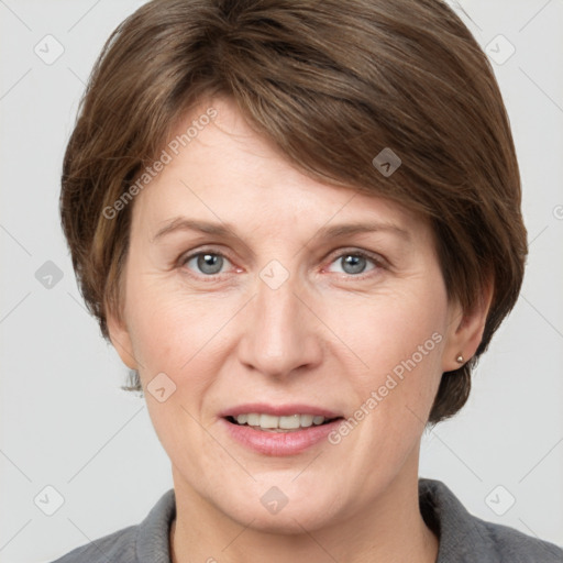 Joyful white adult female with medium  brown hair and grey eyes