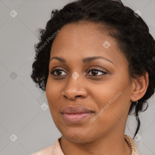 Joyful black young-adult female with medium  brown hair and brown eyes