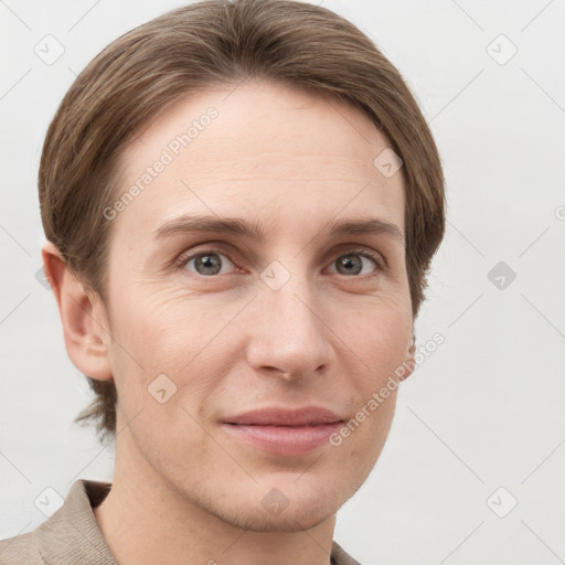 Joyful white young-adult female with short  brown hair and grey eyes