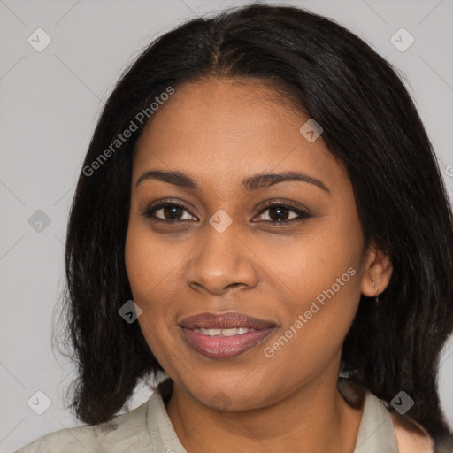 Joyful black young-adult female with medium  black hair and brown eyes