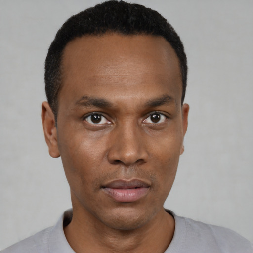 Neutral black young-adult male with short  black hair and brown eyes
