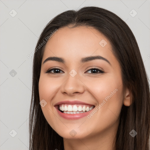 Joyful white young-adult female with long  black hair and brown eyes