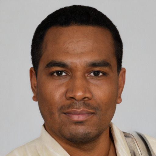 Neutral black young-adult male with short  black hair and brown eyes