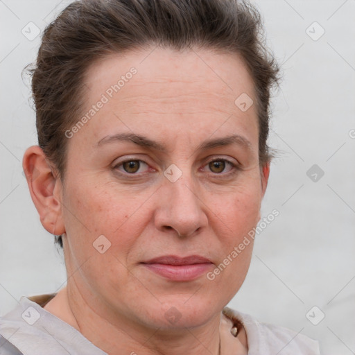 Joyful white adult female with short  brown hair and grey eyes