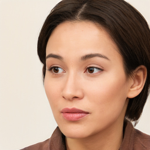 Neutral white young-adult female with medium  brown hair and brown eyes