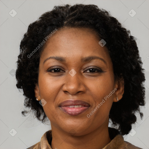 Joyful black adult female with medium  brown hair and brown eyes