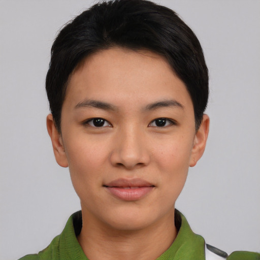 Joyful asian young-adult female with short  black hair and brown eyes