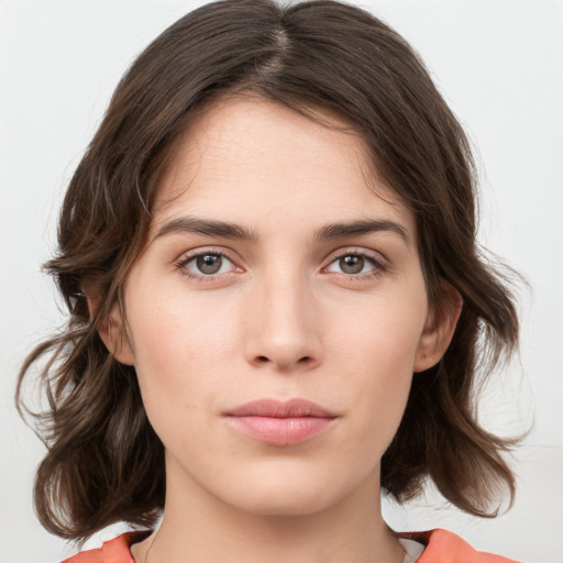 Neutral white young-adult female with medium  brown hair and brown eyes