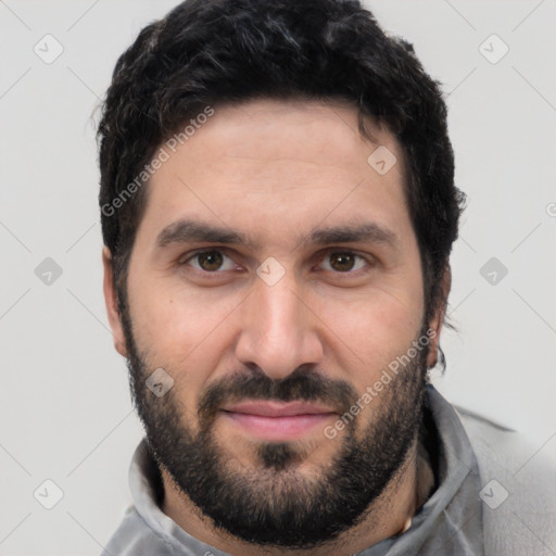 Joyful white young-adult male with short  black hair and brown eyes