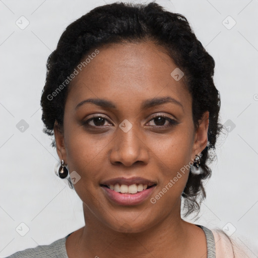 Joyful black young-adult female with short  black hair and brown eyes