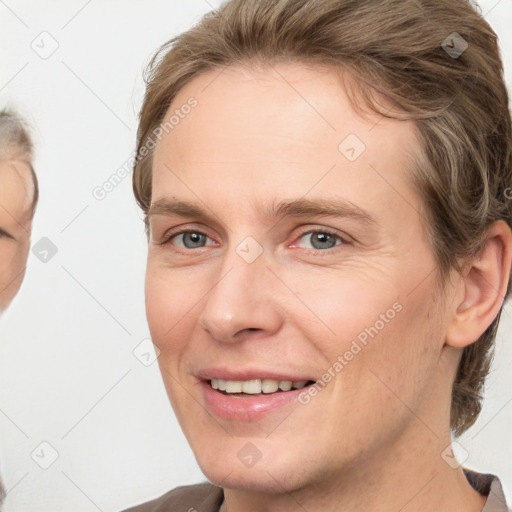 Joyful white adult female with short  brown hair and grey eyes