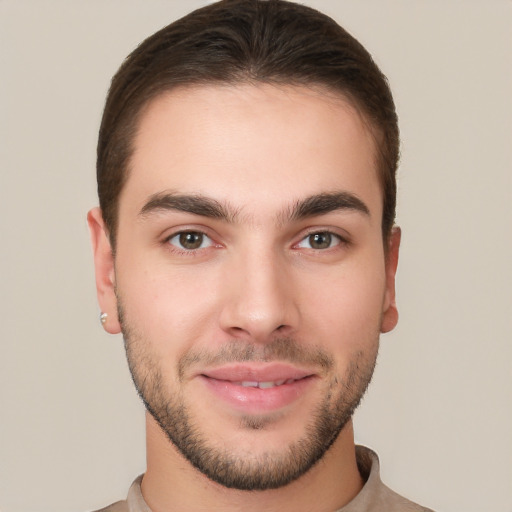 Joyful white young-adult male with short  brown hair and brown eyes