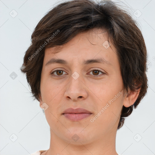 Joyful white adult female with short  brown hair and brown eyes