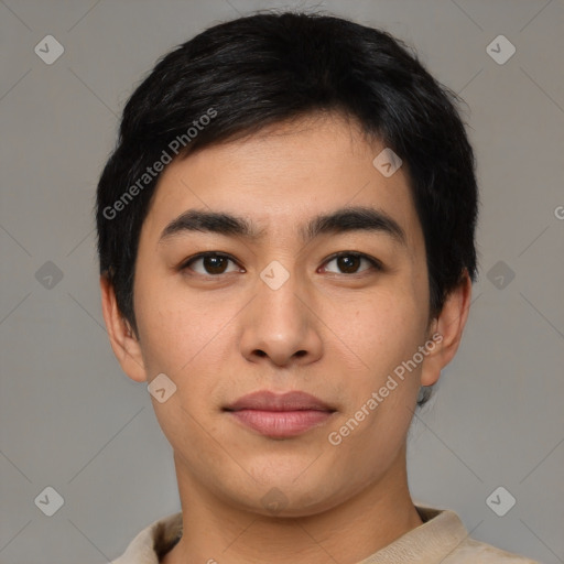 Joyful latino young-adult male with short  black hair and brown eyes