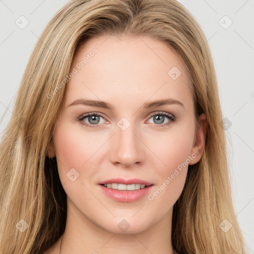 Joyful white young-adult female with long  brown hair and green eyes