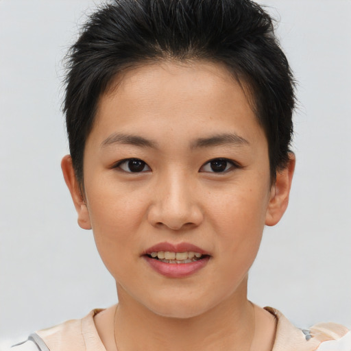 Joyful asian young-adult female with short  brown hair and brown eyes