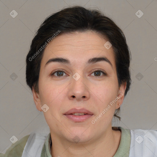 Joyful white adult female with short  brown hair and brown eyes