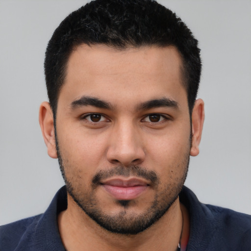 Neutral latino young-adult male with short  black hair and brown eyes