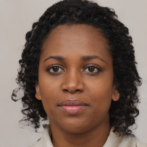 Neutral black young-adult female with medium  black hair and brown eyes