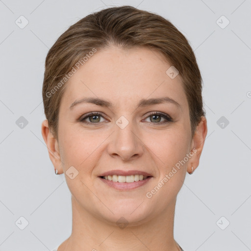 Joyful white young-adult female with short  brown hair and grey eyes