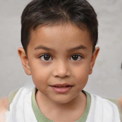 Joyful white child male with short  brown hair and brown eyes