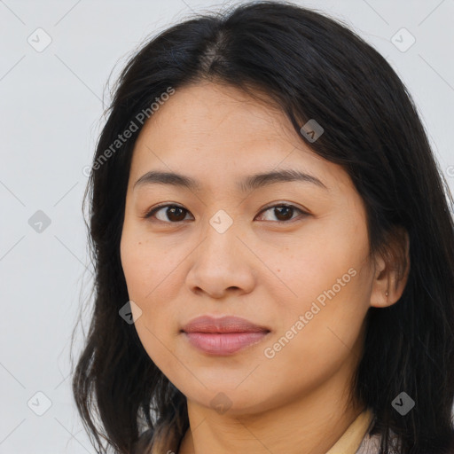 Joyful latino young-adult female with long  brown hair and brown eyes