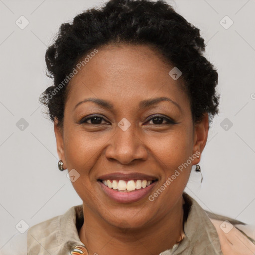 Joyful black adult female with short  brown hair and brown eyes