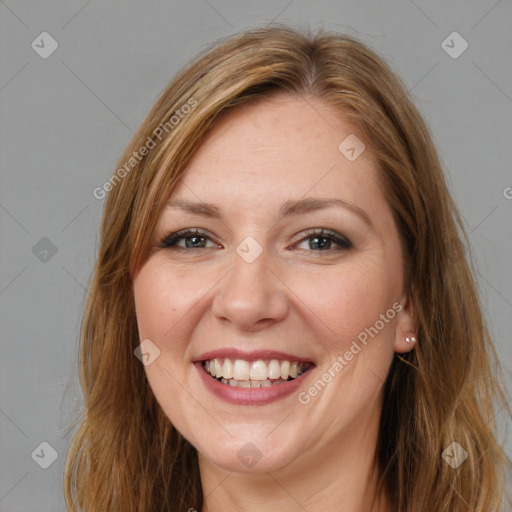 Joyful white young-adult female with long  brown hair and brown eyes