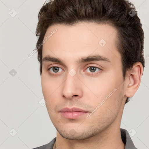 Neutral white young-adult male with short  brown hair and brown eyes