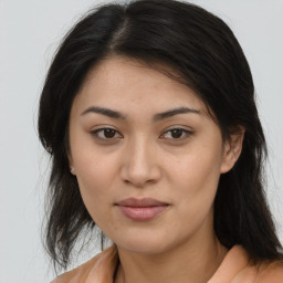 Joyful asian young-adult female with medium  brown hair and brown eyes