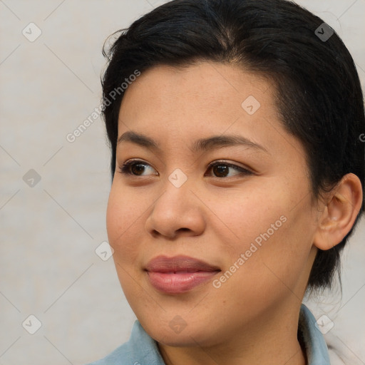 Joyful asian young-adult female with medium  brown hair and brown eyes