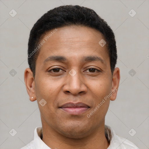 Joyful latino young-adult male with short  brown hair and brown eyes