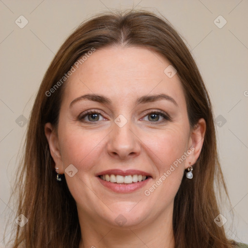 Joyful white adult female with long  brown hair and grey eyes