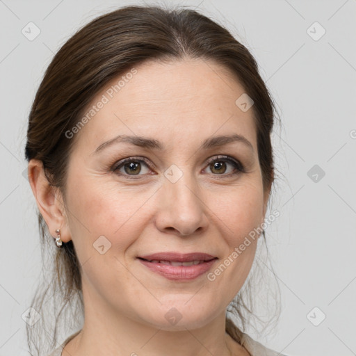 Joyful white adult female with medium  brown hair and grey eyes