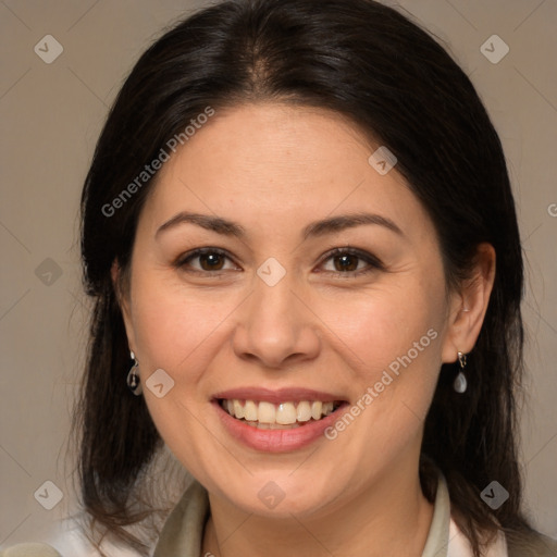 Joyful white adult female with medium  brown hair and brown eyes