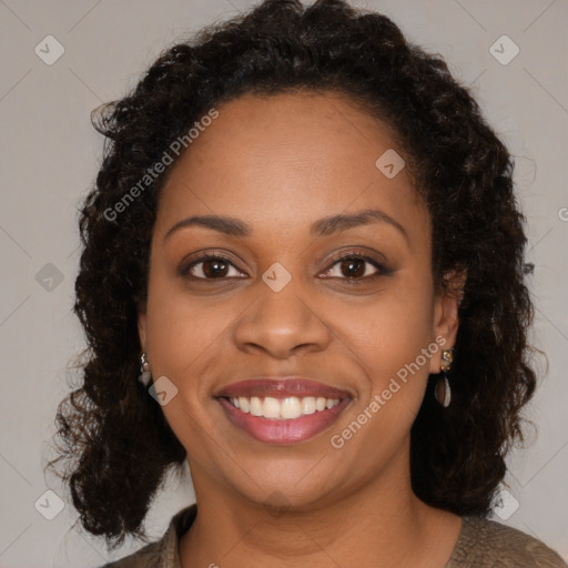 Joyful black young-adult female with medium  brown hair and brown eyes