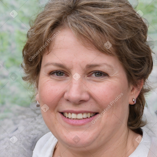 Joyful white adult female with medium  brown hair and blue eyes