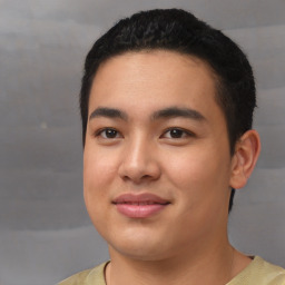 Joyful asian young-adult male with short  black hair and brown eyes