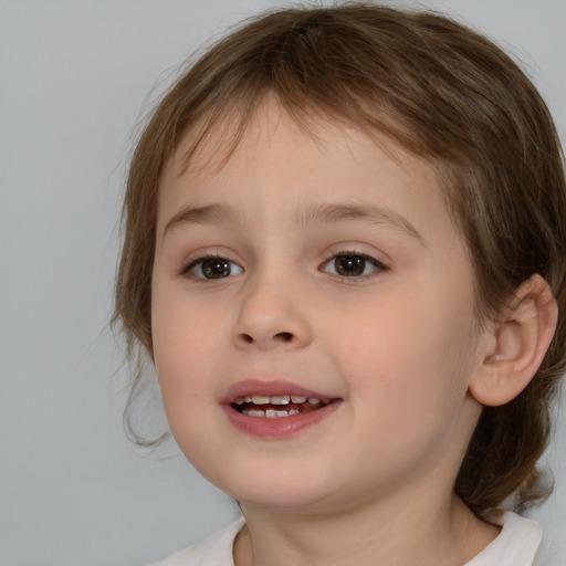 Joyful white child female with medium  brown hair and brown eyes