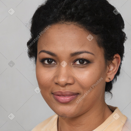 Joyful black young-adult female with medium  black hair and brown eyes