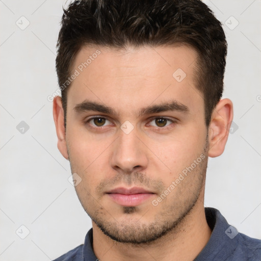 Neutral white young-adult male with short  brown hair and brown eyes