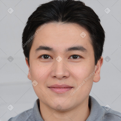 Joyful asian young-adult male with short  black hair and brown eyes