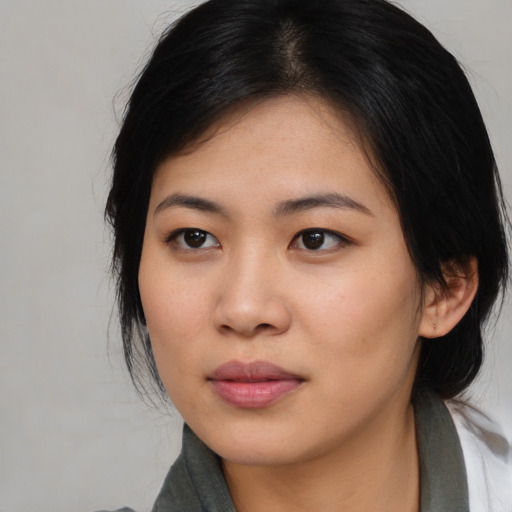 Neutral asian young-adult female with medium  black hair and brown eyes