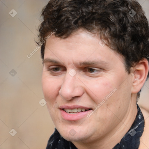 Joyful white adult male with medium  brown hair and brown eyes