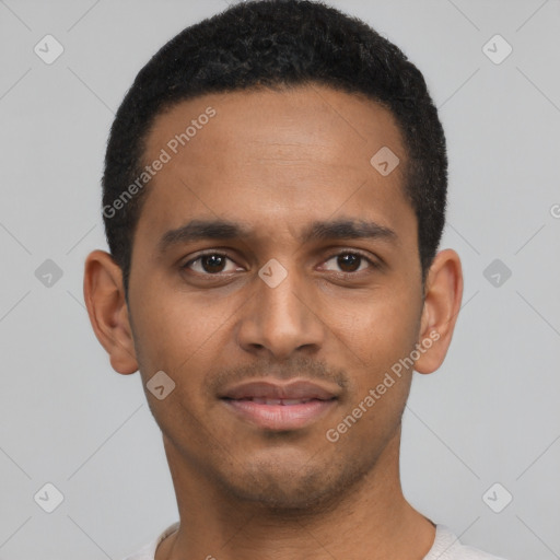 Joyful black young-adult male with short  brown hair and brown eyes